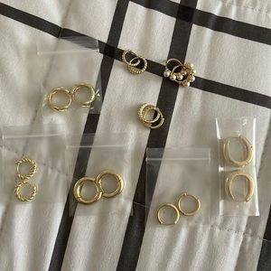 8 gold, stainless steel earrings.